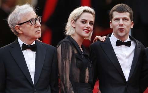 Director Woody Allen (left) with Stewart and Jesse Eisenberg at Cannes. Photo: EPA