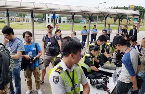 Mediapersons undergo security check at the Hong Kong International Airport ahead of the National People’s Congress Chairman’s three-day visit. Photo: Felix Wong