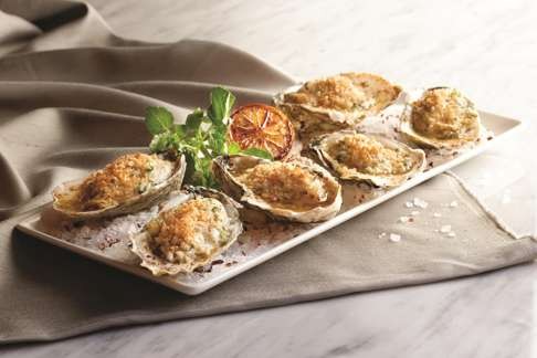 Morton's grilled oysters with garlic herb butter (HK$308).