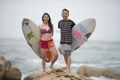 Surfer Cathy Ho with her partner Felix on the Shek O headland in Hong Kong. Photo: Antony Dickson
