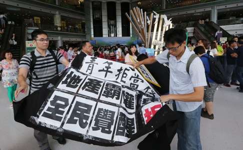 Profit before people: Hongkongers protest against a major property developer selling shoebox-sized flats. Photo: Felix Wong