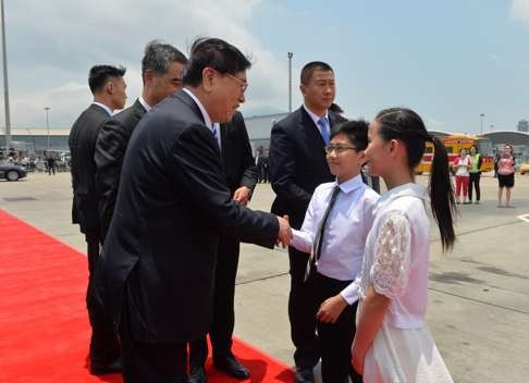 Children say goodbye to Zhang at the airport on Thursday. Photo: SCMP Pictures