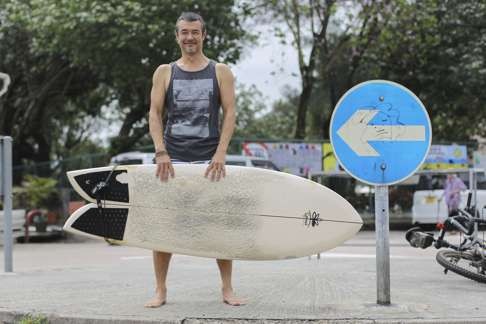 Surfer Sam Pleitgen in Shek O Village. Photo: Bruce Yan