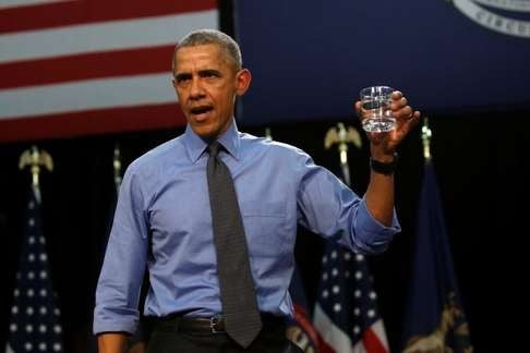 US President Barack Obama drinks a glass of filtered water from Flint, Michigan, a city struggling with the effects of lead-poisoned drinking water. Photo: Reuters