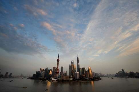 View of the Pudong financial district skyline from the historic Bund in Shanghai . The city is an economic and cultural crossroads, says Michael Ellis, international director of the Michelin guides. Photo: AFP