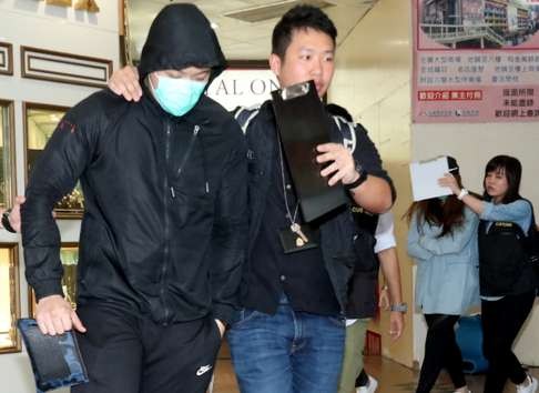 Workers at California Fitness are led away by police. Photo: SCMP Pictures