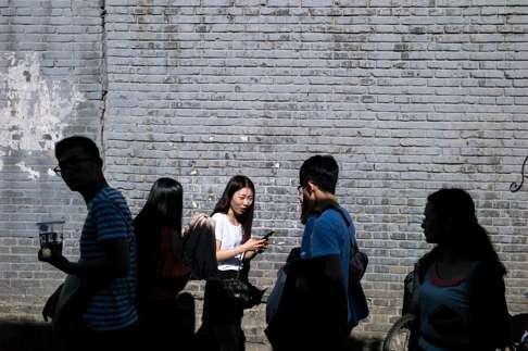 Pedestrians in Beijing. The real cultural revolution is that the leader of the Chinese Communist Party needs to grapple with pretty much the same problems as his Western counterparts. Photo: AFP