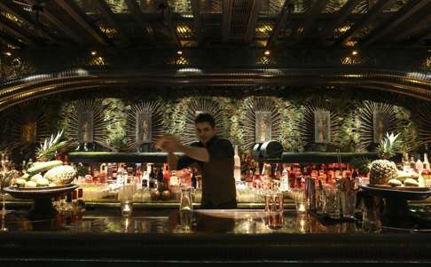 A bartender prepares a drink at Ophelia, the Wan Chai bar designed by Ashley Sutton.