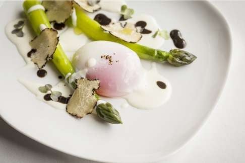 Green asparagus with slow-cooked Japanese egg, taleggio sauce & summer truffle at The Drawing Room.