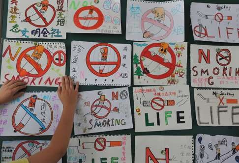 Posters drawn by pupils for an anti-smoking lecture at school in Lingnan, Zhejiang province. Beijing is seeking to stop indoor smoking on June 1 with a new ban and unprecedented fines. Photo: AFP