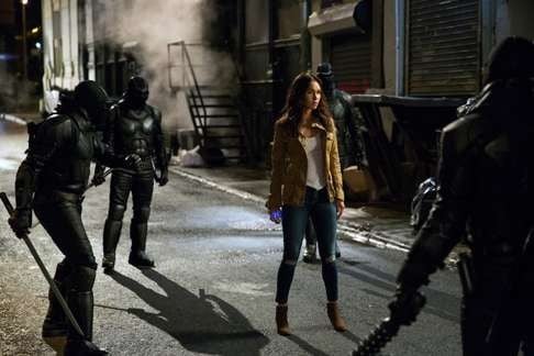 Megan Fox (centre) in a scene from Teenage Mutant Ninja Turtles: Out of the Shadows. Photo: TNS