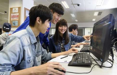Open University of Hong Kong students conduct e-learning in the classroom. Photo: SCMP Pictures