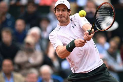 Britain's Andy Murray returns the ball to Serbia's Novak Djokovic.