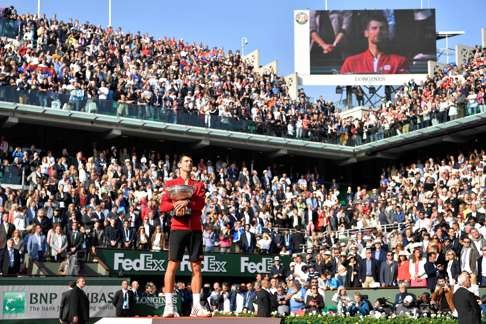 Serbia's Novak Djokovic soaks up the adulations after winning the French Open for the first time.