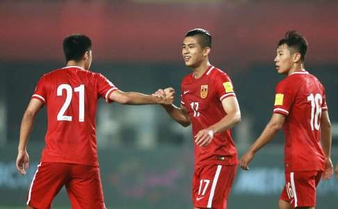 Zhang Yuning is congratulated by teammates.