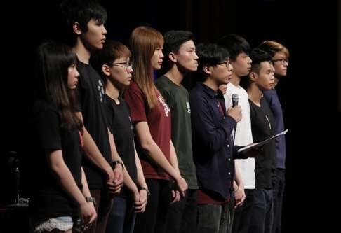 Student leaders read a statement to a packed hall at the Chinese University of Hong Kong, before a forum began in which they criticised the format of the Victoria Park vigil as “rigid”. Photo: AP