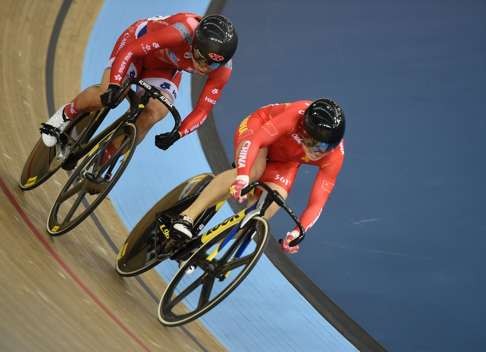 China’s Lin Junhong (right) races Hong Kong’s Sarah Lee in the women’s sprint quarter-finals during the 2016 Track Cycling World Championships at the Lee Valley VeloPark in London. Photo: AFP