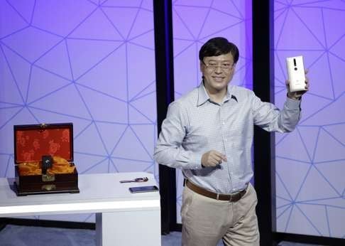 Lenovo Chairman and CEO Yuanqing Yang holds up the new Phab2 Pro phone during the keynote address at the Lenovo Tech World event on June 9, 2016, in San Francisco. Photo: AP