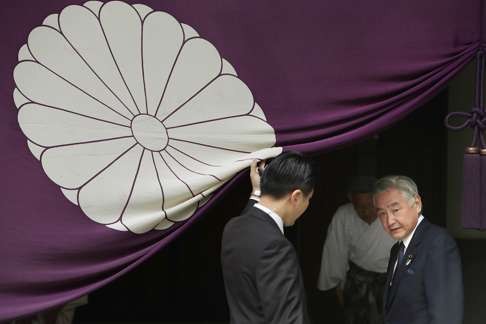 Japan's Justice Minister Mitsuhide Iwaki (right) leaves the Yasukuni Shrine in Tokyo after a visit in April this year. Photo: AFP