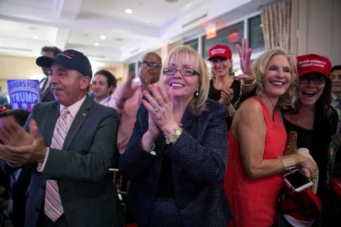 Supporters cheer as Republican presidential candidate Donald Trump speaks during a news conference at the Trump National Golf Club Westchester, in Briarcliff Manor, New York state. Photo: AP