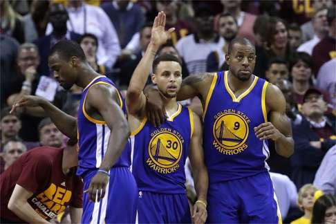 Stephen Curry (centre) and his Warriors teammates take a time-out during game four of the NBA finals. Photo: AFP