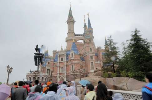 Visitors head to Shanghai Disneyland’s Enchanted Storybook Castle during its trial operation period. Photo: Thomas Yau