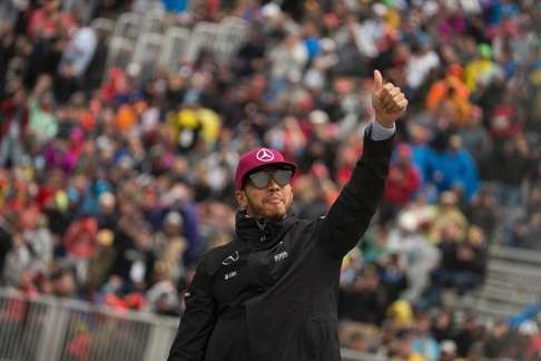 Lewis Hamilton waves to the crowd before the race. Photo: AFP