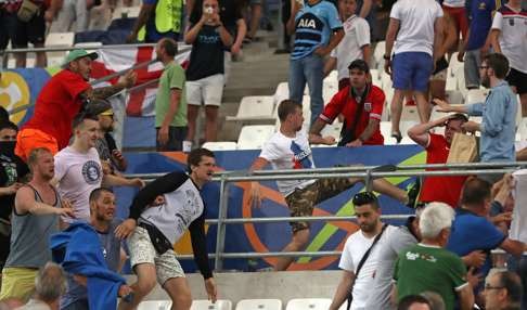 Russian supporters attack England fans at the Velodrome stadium in Marseille on Saturday. Photo: AP