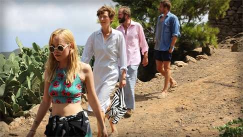 From left: Dakota Johnson, Tilda Swinton, Ralph Fiennes and Matthias Schoenaerts in a still from the film.