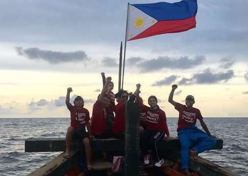 This undated photo taken from the Facebook account of Kalayaan Atin Ito (Kalayaan This Is Ours), a group of Filipino activists, shows Filipino activists on a vessel near the disputed Scarborough Shoal in the South China Sea. Photo: AFP