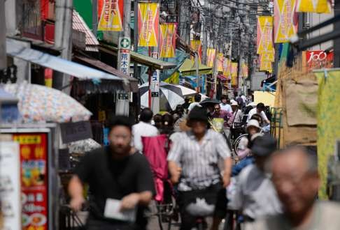 The busy Sunamachi Ginza shopping street in Tokyo. Japan’s consumption tax is low by global standards. Photo: Bloomberg