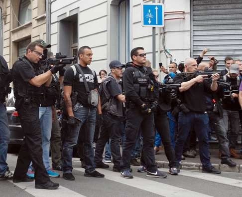 French Police aim their tear gas guns to disperse English fans Photo: AP