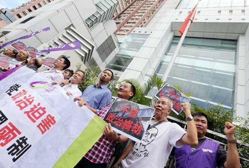 Civic Party members and supporters also gathered outside the liaison office on Friday. Photo: Felix Wong