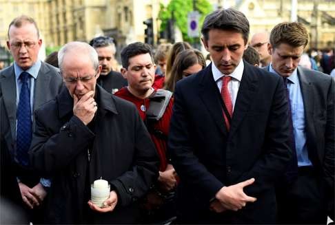 The Archbishop of Canterbury Justin Welby (left) leads a prayer service in memory of British Labour Party MP Jo Cox in London. Photo: Reuters