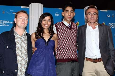 Pictured at the Slumdog Millionaire press conference during the 2008 Toronto International Film Festival are (from left) the film’s writer, Simon Beaufoy, Freida Pinto and Dev Patel, and director Danny Boyle. Photo: Getty Images