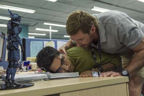 Hugh Jackman and Dev Patel in a scene from Chappie.
