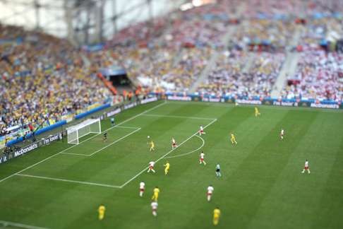 Picture taken with a Tilt Shift lens shows the Velodrome stadium in Marseille on June 21, 2016 during the Euro 2016 group C football match between Ukraine and Poland. / AFP PHOTO / Valery HACHE