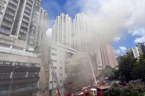 Firefighters battle the blaze at the Amoycan Industrial Centre in Ngau Tau Kok. Photo: Felix Wong