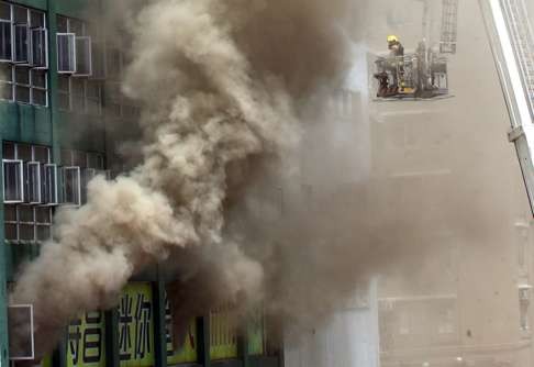 Smoke pours out of the industrial building in Ngau Tau Kok. Photo: Felix Wong