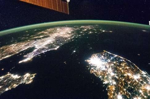 This image, taken from the International Space Station, shows a dark North Korea between China and South Korea. Photo: NASA.