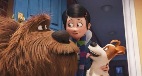 Duke (left, voiced by Eric Stonestreet) and Max greet their mistress.