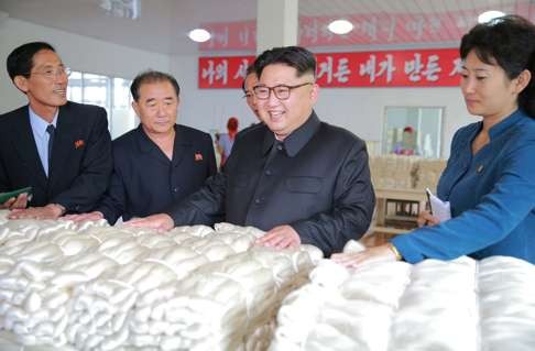 Kim Jong-un visiting a silk mill in Pyongyang. Photo: AFP