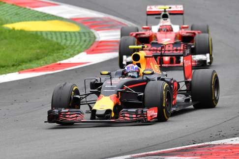 Red Bull driver Max Verstappen steers his car in front of Ferrari driver Kimi Raikkonen during the Austrian Grand Prix. Photo: AP