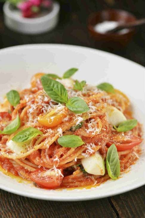 Spaghetti with fresh mozzarella, Parmesan, tomato sauce and basil.