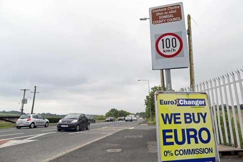 A currency exchange board offering to buy euros is pictured at the side of the road on the controless border between Ireland and Northern Ireland, in Donegal, Ireland on June 25, 2016. Photo: AFP