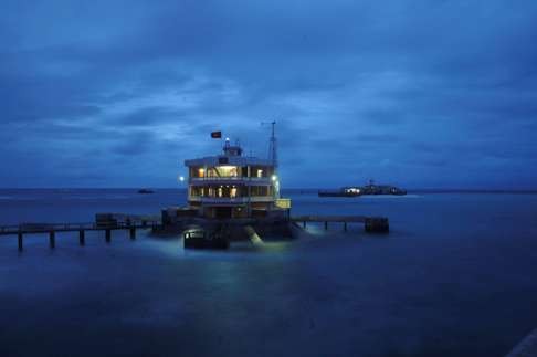 A general view of a building and a pier on Da Tay island in the Spratly archipelago in the South China Sea. Photo: Reuters
