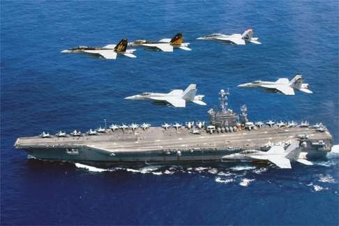 A flight formation above a US aircraft carrier as they carry out exercises in the Philippine Sea amid tensions over the disputed South China Sea in June. Photo: AFP