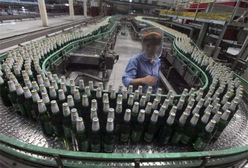 An assembly line at a China Resources Snow Breweries factory. Snow beer is the world’s biggest seller. Photo: Reuters