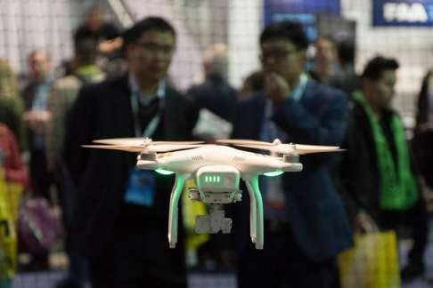 The DJI Phantom 3 Professional drone in flight during a demonstration at the DJI booth at the 2016 International Consumer Electronics Show in Las Vegas, Nevada in January. Photo: Alamy