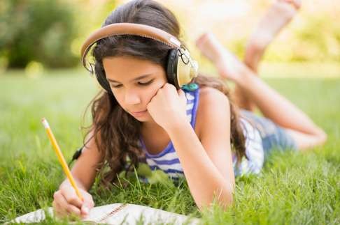 Even if schools are focused on teaching other writing skills, you can help nurture your children’s creativity in their own time. Photo: Alamy